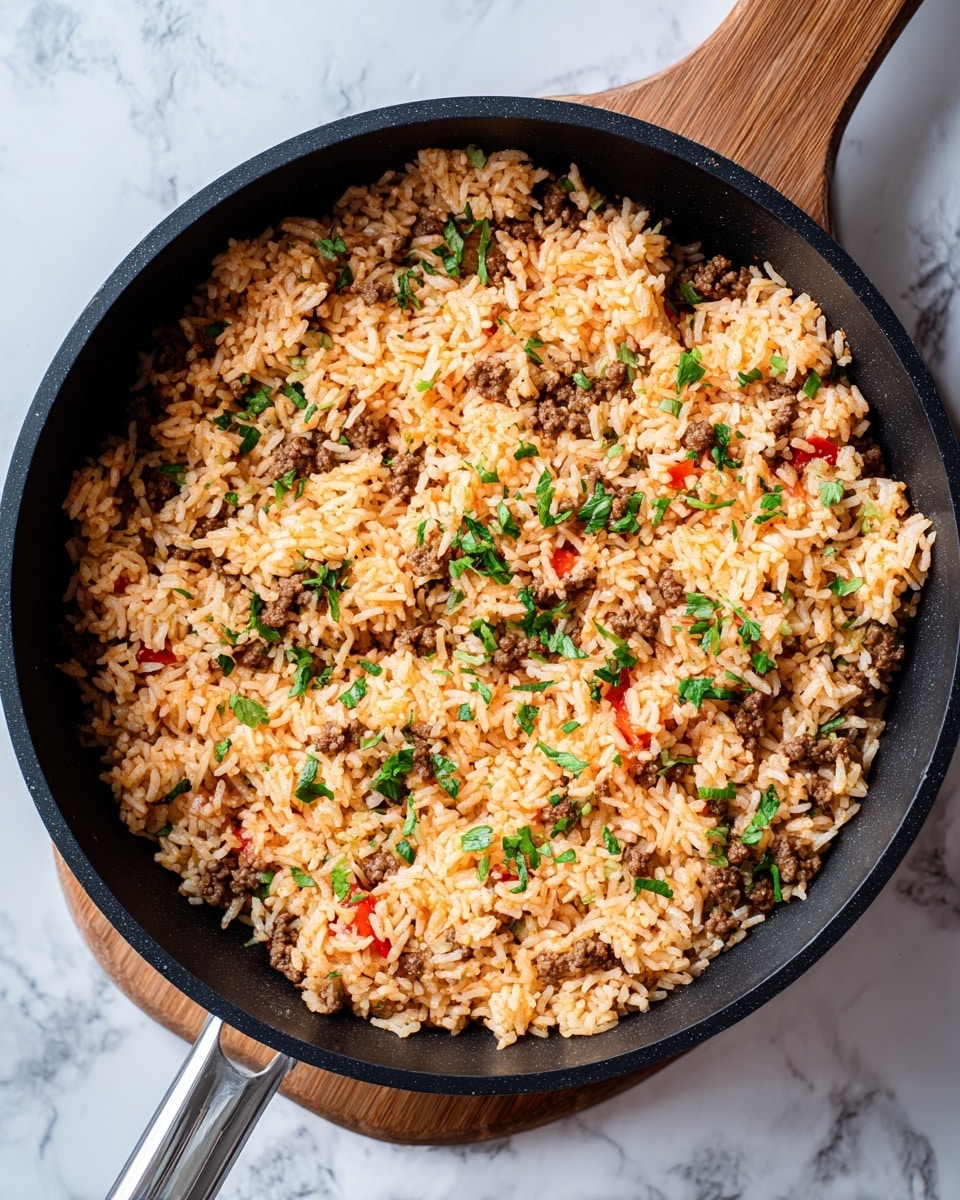 A black pan filled with cooked rice that has a light brown color mixed with small red pepper strips. On top, there are many pieces of dark brown cooked meat scattered around. Green sliced jalapeños and fresh chopped green herbs are spread evenly over the dish, adding fresh vibrant colors. The pan sits on a white marbled surface. photo taken with an iphone --ar 4:5 --v 7