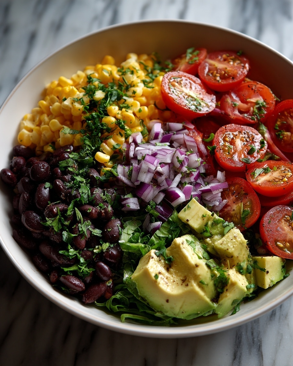 A white bowl filled with a colorful salad made of four main layers mixed together: bright yellow corn kernels, dark black beans, vibrant red cherry tomato halves, and chunky green avocado pieces with some small chopped red onions and fresh green herbs scattered all over. The textures vary from smooth avocado chunks to soft beans and juicy tomato halves, all sitting on a white marbled surface. The food looks fresh and colorful. photo taken with an iphone --ar 4:5 --v 7
