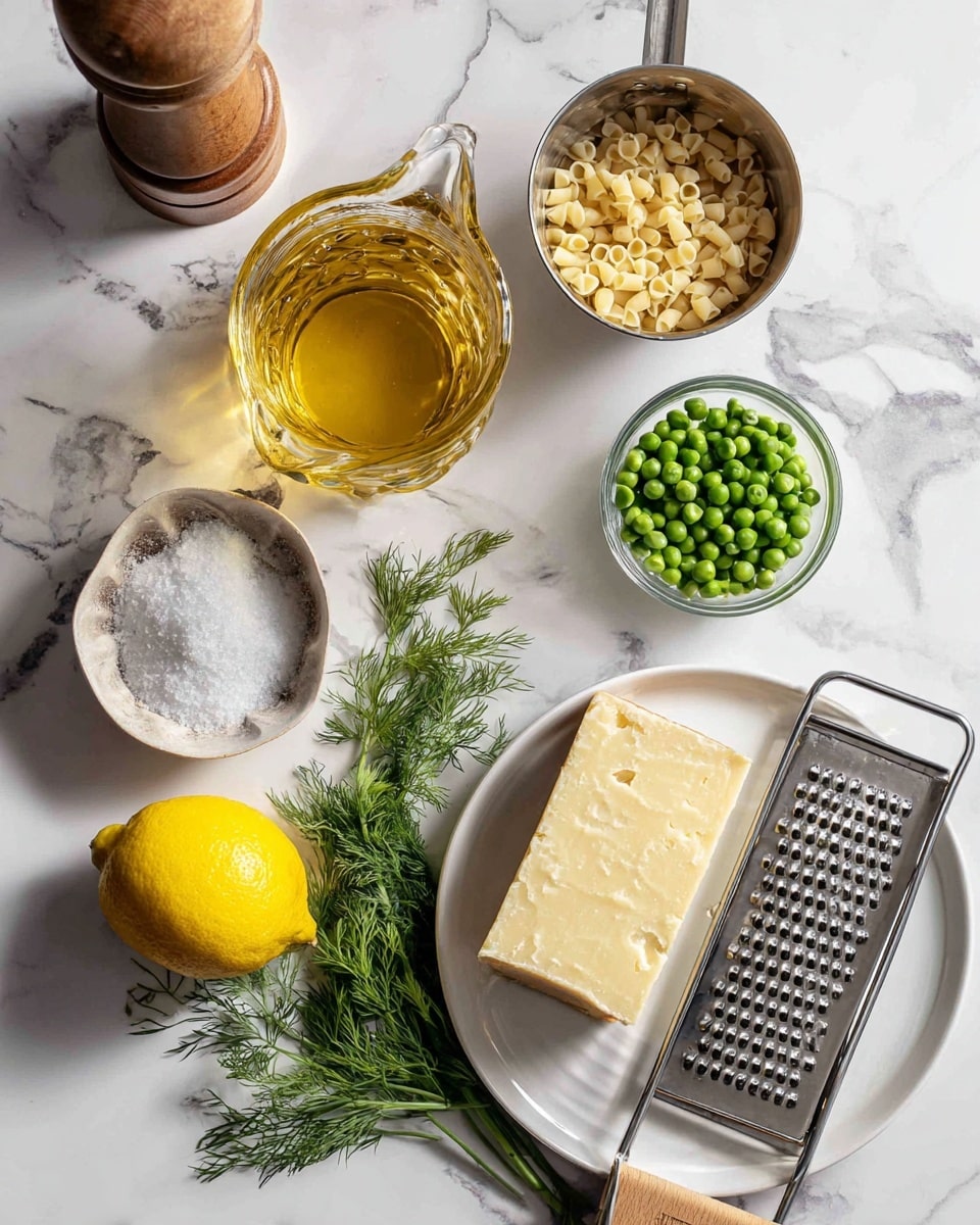 The image shows several cooking ingredients placed neatly on a white marbled surface. There is a glass jug filled with a golden liquid at the top, a metal cup with small pasta pieces near the center, and a clear measuring cup with bright green peas beside it. A round white bowl holds a pile of coarse salt with a few garlic cloves beside it. A whole lemon is placed on a small metal grater with a wooden handle. Fresh green dill leaves lie on the left side. On the bottom right, there is a white ceramic plate with a stainless steel grater on top, partially covered with freshly grated pale yellow cheese and a block of the same cheese resting at one side. A wooden pepper grinder is visible at the top left corner. The overall setup gives a clean and fresh look. photo taken with an iphone --ar 4:5 --v 7