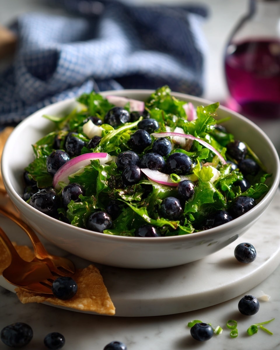 A white bowl filled with a fresh mix of dark blue blueberries, bright green basil leaves, and small pieces of pink onion, all tossed together showing a mix of smooth and leafy textures. Around the bowl, there are a few purple tortilla chips topped with the same blueberry mixture, placed on a white marbled surface. In the background, a blurred purple and white checkered cloth and a bottle with a purple label add soft colors to the scene. Photo taken with an iphone --ar 4:5 --v 7