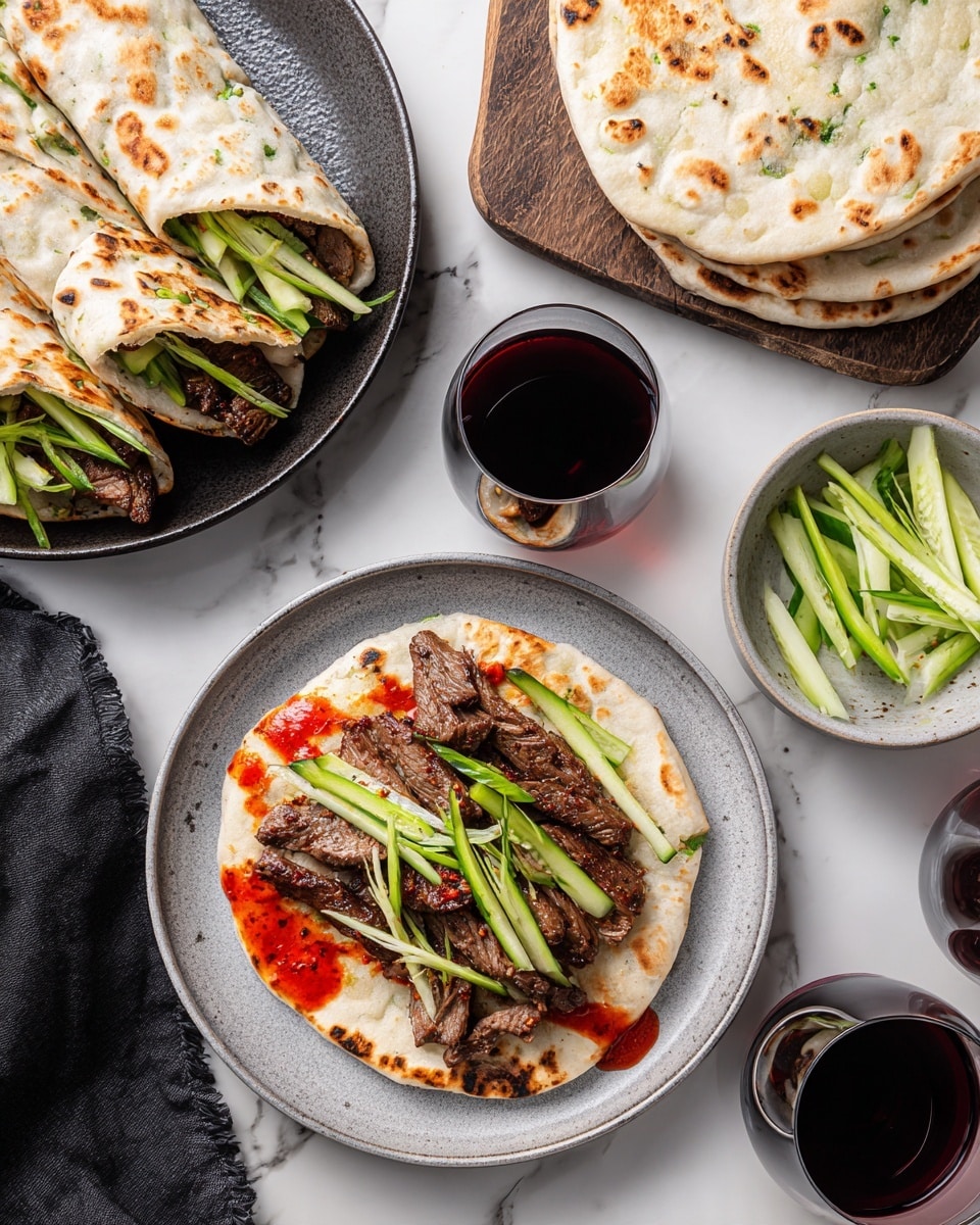 The image shows two wraps on a dark plate, each with a light-colored flatbread folded around three visible layers: dark grilled meat strips at the bottom, bright green cucumber matchsticks and thin light green scallions in the middle, and deep red sauce on top peeking out. Above this plate, there is an open wrap on a white plate with the same layers arranged side by side: flatbread on the bottom, dark grilled meat strips above it, bright green vegetables on top of that, and a smear of shiny red sauce on one side. Nearby, a small bowl holds more bright green cucumber and scallion sticks, and another small bowl next to it contains thick red sauce with a spoon. The scene is set on a dark wood table with a white marbled texture background visible at the edges. Photo taken with an iphone --ar 4:5 --v 7