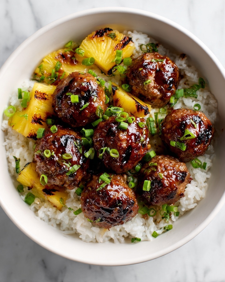 The image shows a white bowl filled with a base layer of fluffy white rice mixed with a few small pieces of grilled pineapple that have charred marks. On top, there are seven shiny, brown meatballs covered in a thick, glossy sauce. The meatballs are garnished with small, bright green chopped scallions scattered over the surface. The bowl is placed on a white marbled surface. photo taken with an iphone --ar 4:5 --v 7
