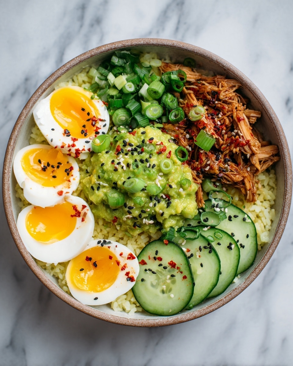 A white bowl holds a layered dish starting with a base of light yellow rice mixed with small green leafy pieces, topped with thin, round slices of cucumber around the edges. Above this is a layer of mashed green avocado spread unevenly. On top of the avocado, there are many small chunks of shredded cooked meat with a slightly reddish seasoning covering parts of it. Thin slices of bright green scallions are scattered over the meat. Around the bowl, four halves of soft-boiled eggs with white edges and bright yellow, runny yolks are placed. Small black sesame seeds are sprinkled across the whole dish on top. The bowl is set on a white marbled surface. photo taken with an iphone --ar 4:5 --v 7